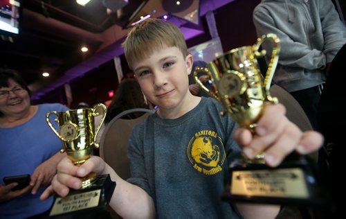 TREVOR HAGAN / WINNIPEG FREE PRESS
Tristan Dumas, 6, won the left and right arm categories for his age at the Manitoba Provincial Arm Wrestling Championships at Canad Inns Polo Park, Saturday, April 13, 2019.