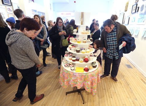 JASON HALSTEAD / WINNIPEG FREE PRESS

Attendees check out the cupcake selection at the Mentoring Artists for Womens Art (MAWA) annual Over the Top Art Auction and Cupcake Party on March 17, 2019 at MAWA's storefront space on Main Street. (See Social Page)