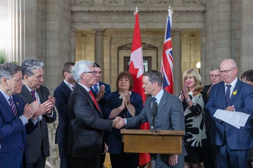 SASHA SEFTER / WINNIPEG FREE PRESS
Cameron Friesen, Minister of Health, Seniors and Active Living for the Province of Manitoba, right,  shakes hands with  Jim Carr, Minister of International Trade Diversification during a bilateral agreement announcement at the Manitoba Legislative Building.
190416 - Tuesday, April 16, 2019.