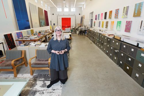 MIKE DEAL / WINNIPEG FREE PRESS
Artist Wanda Koop in her Winnipeg Studio with one of the ten sketch books she carried with her that she filled with drawings of the Notre Dame Cathedral during her six-month Canada Council Paris Studio trip.
190416 - Tuesday, April 16, 2019.