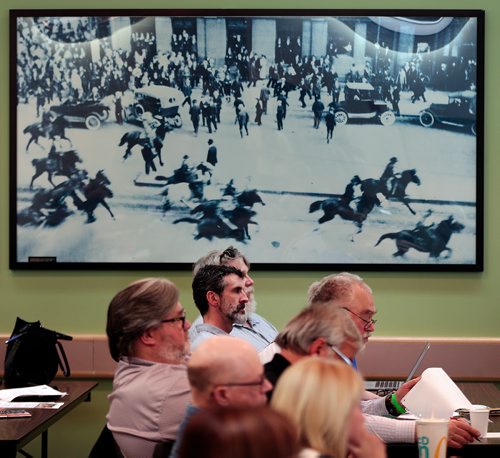 PHIL HOSSACK / WINNIPEG FREE PRESS - Under a large photo of mounted police charging strikers in 1919, WLC members attend the first monthly meeting of the Winnipeg Labour Council since president Basia Sokal's well-publicized resignation is at 6 p.m. at Union Centre on Broadway - April16, 2019.