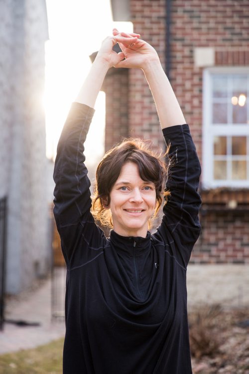 MIKAELA MACKENZIE/WINNIPEG FREE PRESS
Avid runner Sylvia Buchholz does a sun salutation before running to work in Winnipeg on Wednesday, April 17, 2019. 
Winnipeg Free Press 2019