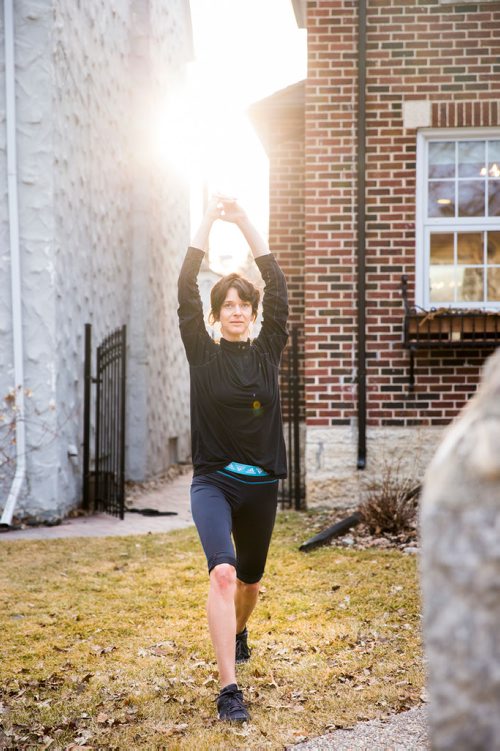 MIKAELA MACKENZIE/WINNIPEG FREE PRESS
Avid runner Sylvia Buchholz does a sun salutation before running to work in Winnipeg on Wednesday, April 17, 2019. 
Winnipeg Free Press 2019