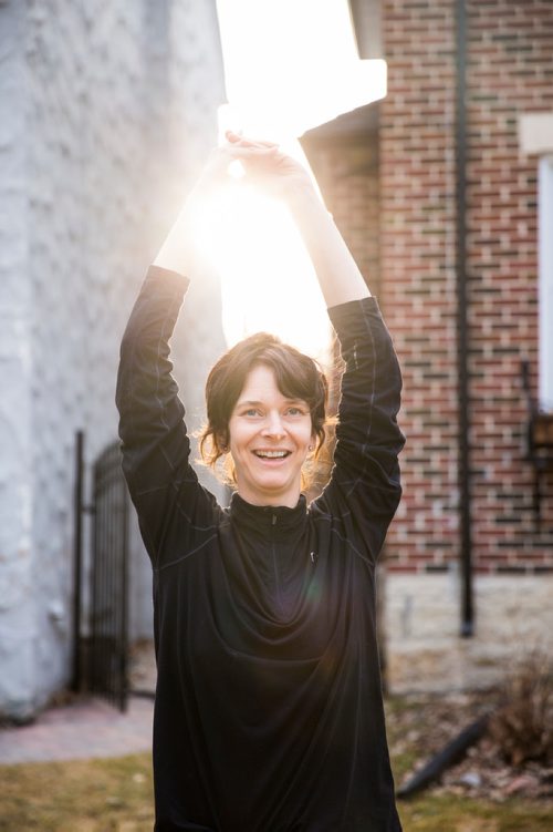 MIKAELA MACKENZIE/WINNIPEG FREE PRESS
Avid runner Sylvia Buchholz does a sun salutation before running to work in Winnipeg on Wednesday, April 17, 2019. 
Winnipeg Free Press 2019