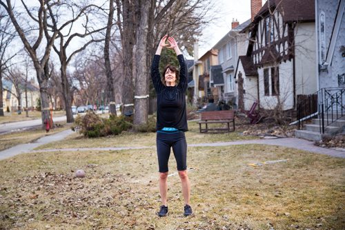 MIKAELA MACKENZIE/WINNIPEG FREE PRESS
Avid runner Sylvia Buchholz does a sun salutation before running to work in Winnipeg on Wednesday, April 17, 2019. 
Winnipeg Free Press 2019