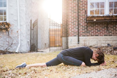 MIKAELA MACKENZIE/WINNIPEG FREE PRESS
Avid runner Sylvia Buchholz does a pigeon pose stretch before running to work in Winnipeg on Wednesday, April 17, 2019. 
Winnipeg Free Press 2019