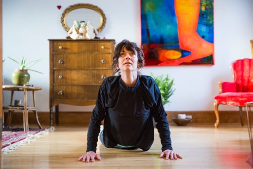 MIKAELA MACKENZIE/WINNIPEG FREE PRESS
Avid runner Sylvia Buchholz does a sun salutation before running to work in Winnipeg on Wednesday, April 17, 2019. 
Winnipeg Free Press 2019