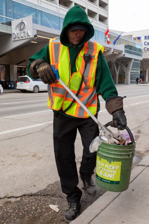 SASHA SEFTER / WINNIPEG FREE PRESS
General Maintenance worker James Turner of Downtown BIZ's Enviro Team picks up litter along St Mary Avenue in downtown Winnipeg. See Declan Schroeder story.
190417 - Wednesday, April 17, 2019.