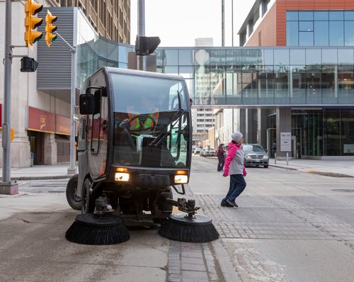 SASHA SEFTER / WINNIPEG FREE PRESS
District Operator Leslie Hennessy of Downtown BIZ's Enviro Team uses a sidewalk sweeper to clean up Hargrave Street just south of Portage Avenue in downtown Winnipeg. See Declan Schroeder story.
190417 - Wednesday, April 17, 2019.
