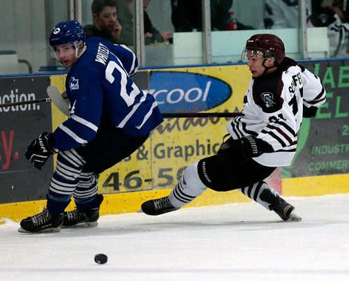 PHIL HOSSACK / WINNIPEG FREE PRESS - St James Canuck #24 Mack Whitely looses  Pembina Valley Twister #21 Sven Schefer along the boards Wednesday evening in Morris MMJHL Playoff action. - April 17, 2019.