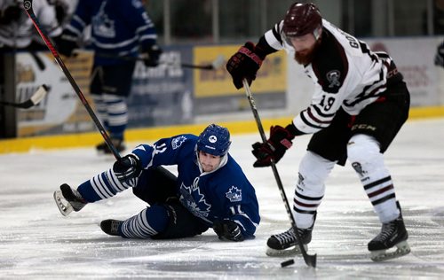 PHIL HOSSACK / WINNIPEG FREE PRESS - St James Canuck #11 Cole Chicoine watches the play after loosing a breakaway to Pembina Valley Twister #19 Jerome Goderis Wednesday evening when his skate blade snapped off his boot in Morris MMJHL Playoff action. - April 17, 2019.