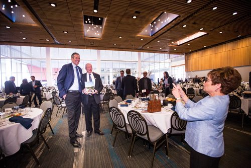 MIKAELA MACKENZIE/WINNIPEG FREE PRESS
Brigette Sandron, senior vice president of Travel Manitoba, takes a picture of Premier Brian Pallister and Colin Ferguson, president and CEO of Travel Manitoba, at a Chamber of Commerce event at the RBC Convention Centre in Winnipeg on Thursday, April 18, 2019. 
Winnipeg Free Press 2019