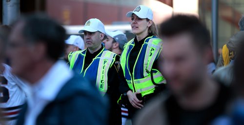 PHIL HOSSACK / WINNIPEG FREE PRESS - Police watch the crowds Thursday as fans took to the streets downtown for festivities. - April 18, 2019.