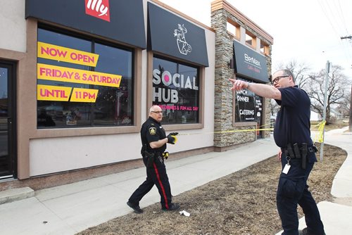 MIKE DEAL / WINNIPEG FREE PRESS
Winnipeg Police at BerMax Caffé and Bistro Friday afternoon. A woman was assaulted and the restaurant she was working in was the target of hate-related vandalism and a robbery on Thursday night, Winnipeg police said.
190419 - Friday, April 19, 2019