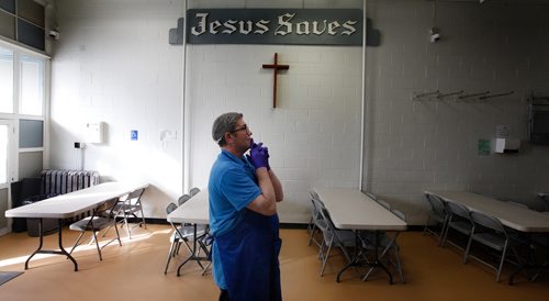 PHIL HOSSACK / WINNIPEG FREE PRESS - Peter Krasuski pauses before the doors open to a flood of 'patrons' at the LightHouse Mission on Main street for a traditional Good Friday holiday meal. See release.  - April 19, 2019.