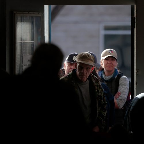 PHIL HOSSACK / WINNIPEG FREE PRESS -  300 plus 'patrons' come through the front door to line up at the LightHouse Mission on Main street for a traditional Good Friday holiday meal. See release.  - April 19, 2019.