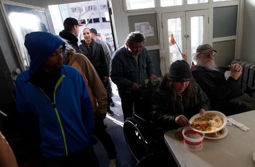 PHIL HOSSACK / WINNIPEG FREE PRESS - Main street residents take out leftovers for later while others line up for the main course at the LightHouse Mission on Main street for a traditional Good Friday holiday meal. See release.  - April 19, 2019.