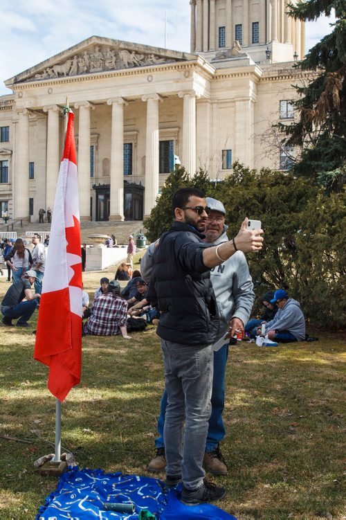 MIKE DEAL / WINNIPEG FREE PRESS
George Rodrigues (right) and Aneesh Sharma take a selfie during 4/20 celebrations at the MB legislature.
The first 4/20 celebration since cannabis was legalized happened on the grounds of the Manitoba legislature Saturday.
190420 - Saturday, April 20, 2019.