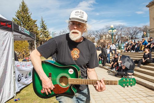 MIKE DEAL / WINNIPEG FREE PRESS
Jack D Zastre plays his guitar during the first 4/20 celebration since cannabis was legalized happened on the grounds of the Manitoba legislature Saturday.
190420 - Saturday, April 20, 2019.