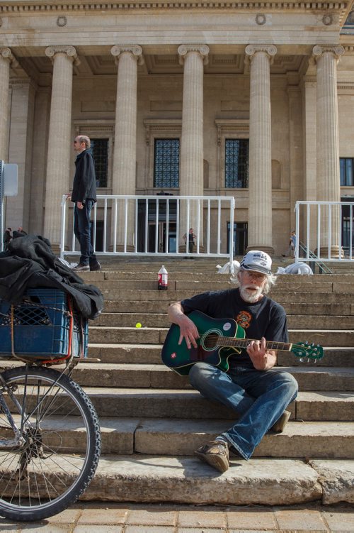 MIKE DEAL / WINNIPEG FREE PRESS
Jack D Zastre plays his guitar during the first 4/20 celebration since cannabis was legalized happened on the grounds of the Manitoba legislature Saturday.
190420 - Saturday, April 20, 2019.