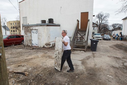MIKE DEAL / WINNIPEG FREE PRESS
Tracy Jensen, Director of River City Bud Co, along with other members of the River City Bud Co clean up the area around Prichard Avenue and Salter Street Saturday afternoon during a BBQ for the community. 
190420 - Saturday, April 20, 2019.