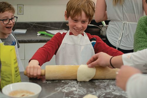 Canstar Community News Zach Blakeston rolls dough and Colby Houston laughs during Westdale Community Centre's Kids in the Kitchen program. (EVA WASNEY/CANSTAR COMMUNITY NEWS/METRO)