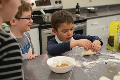 Canstar Community News Sammy McFee rolls dough during Westdale Community Centre's Kids in the Kitchen program. (EVA WASNEY/CANSTAR COMMUNITY NEWS/METRO)