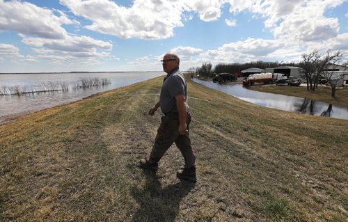 RUTH BONNEVILLE / WINNIPEG FREE PRESS 


LOCAL - Flooding story near Morris Mb. 
Farmer, Hubs Sabourin, walks over a dike that was built after the 1997 flood toward his flooded farmland which  covers  about 4,000 acres of his land, Monday. 

Hubs Sabourin has a farm in the area of RM of Franklin, southeast  of Morris, where farmers are experiencing flooding on their farmland.  

See Kevin Rollason's story.


April 22, 2019
