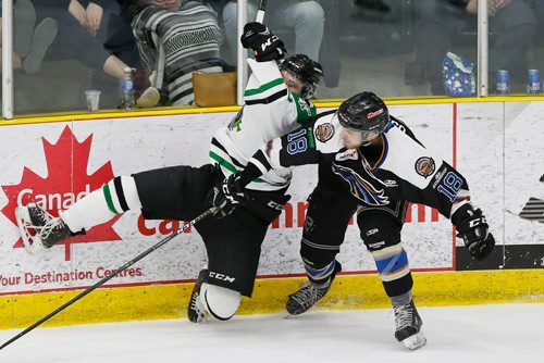 JOHN WOODS / WINNIPEG FREE PRESS
Portage Terriers' Owen Murray (5) gets checked by Swan Valley Stampeders' Matthew Osadick (18) during the second period of game seven MJHL Turnbull Cup action in Portage La Prairie on Monday, April 22, 2018.

Reporter: