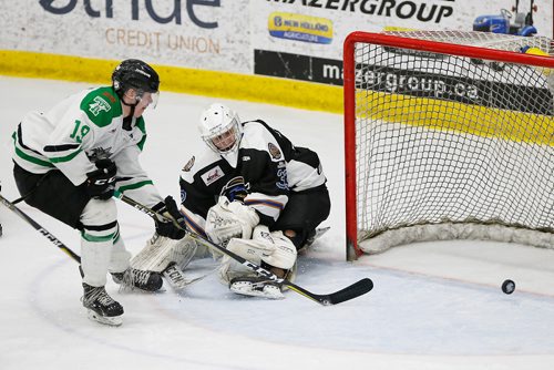 JOHN WOODS / WINNIPEG FREE PRESS
Portage Terriers' Reece Henry (19) scores the championship winning goal in overtime against Swan Valley Stampeders goaltender Merek Pipes (33) in game seven MJHL Turnbull Cup action in Portage La Prairie on Monday, April 22, 2018.

Reporter: