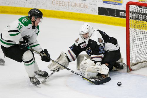 JOHN WOODS / WINNIPEG FREE PRESS
Portage Terriers' Reece Henry (19) scores the championship winning goal in overtime against Swan Valley Stampeders goaltender Merek Pipes (33) in game seven MJHL Turnbull Cup action in Portage La Prairie on Monday, April 22, 2018.

Reporter: