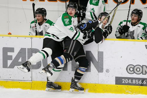 JOHN WOODS / WINNIPEG FREE PRESS
Portage Terriers' Reece Henry (19) checks Swan Valley Stampeders' Bradly Goethals (15) during the first period of game seven MJHL Turnbull Cup action in Portage La Prairie on Monday, April 22, 2018.

Reporter:
