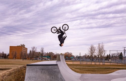 SASHA SEFTER / WINNIPEG FREE PRESS
31 year old Ron McRae does a backflip on his BMX in the newly revamped skate park in Victoria Jason Park in Winnipeg's Transcona suburb.  
190423 - Tuesday, April 23, 2019.