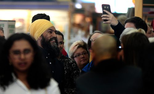 PHIL HOSSACK / WINNIPEG FREE PRESS - Jagmeet Singh pauses for a fan's camera as he enters the McNally Robinson 'atrium' to launch his new book, "Love and Courage" Thursday afternoon. See Bill Redekopp story. - April 25, 2019.