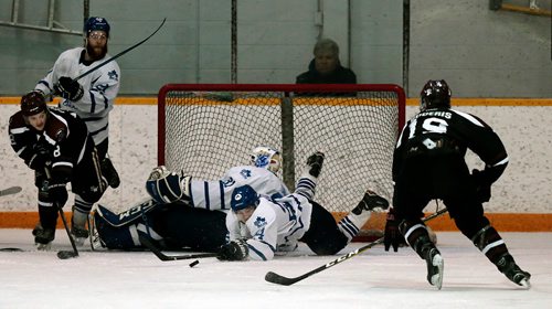 PHIL HOSSACK / WINNIPEG FREE PRESS -  ST JAMES CANUCK#24 MAC WHITELY DIVES TO CLEAR THE PUCK IN FRONT OF GOALIE #31 NATHAN CVAR THURSDAY AT THE ST JAMES CIVIC CENTRE. JAY BELL STORY. - April 25, 2019.