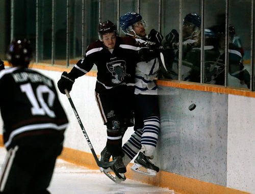 PHIL HOSSACK / WINNIPEG FREE PRESS - PEMBINA VALLEY TWISTER #8 TRAVIS PENNER SLAMS ST JAMES CANUCK#20 WYATT KEMBALL INTO THE BOARDS THURSDAY AT THE ST JAMES CIVIC CENTRE. JAY BELL STORY. - April 25, 2019.