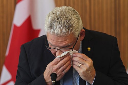 MIKE DEAL / WINNIPEG FREE PRESS
Doug McNeil, Winnipegs CAO wipes away a tear while speaking during the Day of Mourning Ceremony at City Hall Friday morning. 
190426 - Friday, April 26, 2019