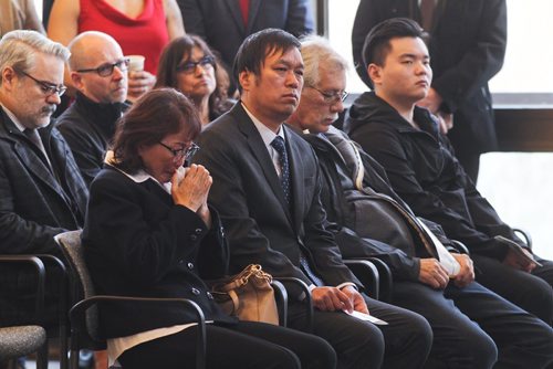MIKE DEAL / WINNIPEG FREE PRESS
The family of Xiaochun Luo who died while working for the city in May 2018, during the Day of Mourning Ceremony at City Hall Friday morning. 
190426 - Friday, April 26, 2019