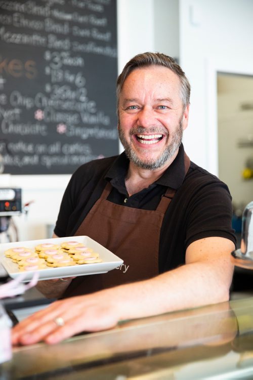 MIKAELA MACKENZIE/WINNIPEG FREE PRESS
Owner Christopher Atkinson poses with his Imperial cookies at Lilac Bakery in Winnipeg on Thursday, April 25, 2019. For Dave Sanderson story.
Winnipeg Free Press 2019