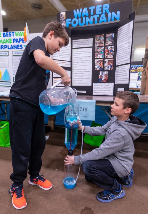 SASHA SEFTER / WINNIPEG FREE PRESS
Grade four students Dean Ott (9) (left) and Nevio Wulf (9) demonstrate their gravity water fountain at the Manitoba Schools Science Symposium which is being held in the Max Bell Centre on the University of Manitoba campus.
190426 - Friday, April 26, 2019.