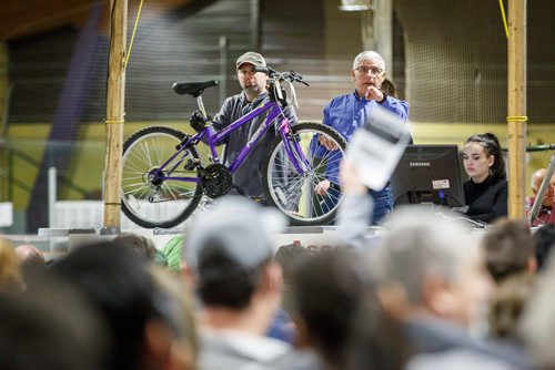 MIKE DEAL / WINNIPEG FREE PRESS
Auctioneer Alex Lloyd points at a bidder Saturday morning at the Terry Sawchuck Arena where about 650 bikes will go up for auction during the two-day annual City of Winnipeg bike sale. 
190427 - Saturday, April 27, 2019.