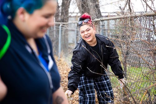 MIKAELA MACKENZIE/WINNIPEG FREE PRESS
Reanna Marinco laughs while picking up garbage at Winnipeg BIZ's 14th annual Earth Day Cleanup in Winnipeg on Monday, April 29, 2019. 
Winnipeg Free Press 2019