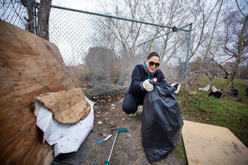 MIKAELA MACKENZIE/WINNIPEG FREE PRESS
Marcy Abraham, a teacher at the Aboriginal Community Campus, picks up garbage at Winnipeg BIZ's 14th annual Earth Day Cleanup in Winnipeg on Monday, April 29, 2019. 
Winnipeg Free Press 2019