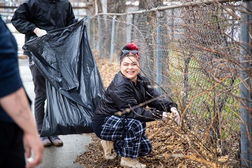 MIKAELA MACKENZIE/WINNIPEG FREE PRESS
Reanna Marinco laughs while picking up garbage at Winnipeg BIZ's 14th annual Earth Day Cleanup in Winnipeg on Monday, April 29, 2019. 
Winnipeg Free Press 2019