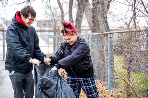 MIKAELA MACKENZIE/WINNIPEG FREE PRESS
Evan Hawkins and Reanna Marinco laugh while picking up garbage at Winnipeg BIZ's 14th annual Earth Day Cleanup in Winnipeg on Monday, April 29, 2019. 
Winnipeg Free Press 2019