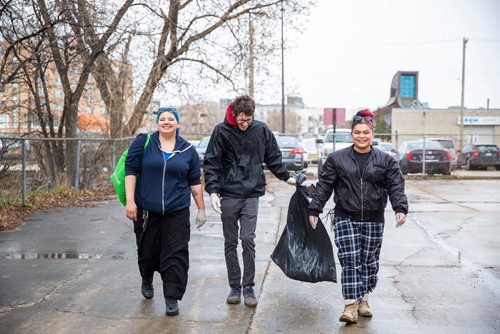 MIKAELA MACKENZIE/WINNIPEG FREE PRESS
Cheyenne Fontaine (left), Evan Hawkins, and Reanna Marinco pick up garbage at Winnipeg BIZ's 14th annual Earth Day Cleanup in Winnipeg on Monday, April 29, 2019. 
Winnipeg Free Press 2019