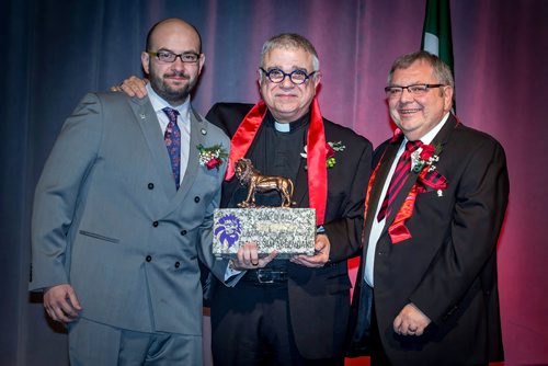 SUBMITTED PHOTO / MIREK WEICHSEL & JOHN GIAVEDONI

Father Sam Argenziano of Holy Rosary Parish (middle) is awarded the Sons of Italy Heart of the Lion Lifetime Achievement Award by Dino Petrelli (left, president, Garibaldi Lodge) and Joseph Monachino (right, president, Order Sons of Italy of Canada) at the 33rd Annual Sons of Italy Garibaldi Lodge Gala on March 16, 2019 at the RBC Convention Centre Winnipeg. (See Social Page)