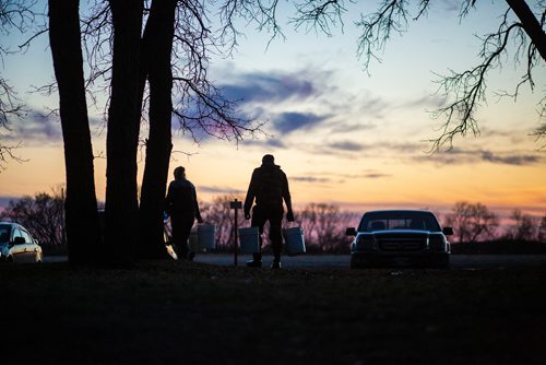 MIKAELA MACKENZIE/WINNIPEG FREE PRESS
People haul suckerfish back to their vehicles in Westbourne, Manitoba on Monday, April 22, 2019. 
Winnipeg Free Press 2019