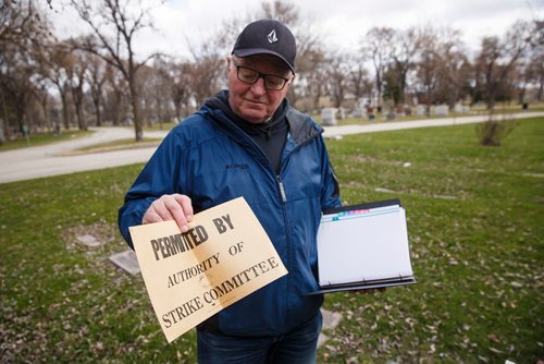 MIKE DEAL / WINNIPEG FREE PRESS
At the headstone for James Malcolm Carruthers, Paul Moist, past president of CUPE, holds a reproduction of a sign that was created with agreements with labour leaders and the Winnipeg Mayor to allow the delivery of Milk to continue during the Winnipeg General Strike.
Paul Moist does tours of the cemetery, focusing on 14 people from the strike demonstration, who are buried at Brookside.
190430 - Tuesday, April 30, 2019.

see Jessica Botelho-Urbanski story