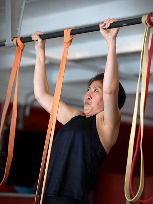 RUTH BONNEVILLE / WINNIPEG FREE PRESS 


HEALTH - Pull-ups

Photo of participant Shih-Han Iwasaki  doing a pull up with the aid of a band.

Description: Pullups from a female perspective - and why they're so difficult for women, how does someone get started, form and technique, that sort of thing.


Female participants learn how to do a pul up with the help of  tainer, Carl Berryman, while the take part in workout class called  SWET (Strong Women Empowered Together) at Yoga Public.  

Berryman starts them off with the aid of rubber bands and they progress through different tensioned bands until they can do a full pull up without using any aid.  

SWET  -- is a strength based program. 

See Sabrina Carnevale story.

April 30, 2019 

